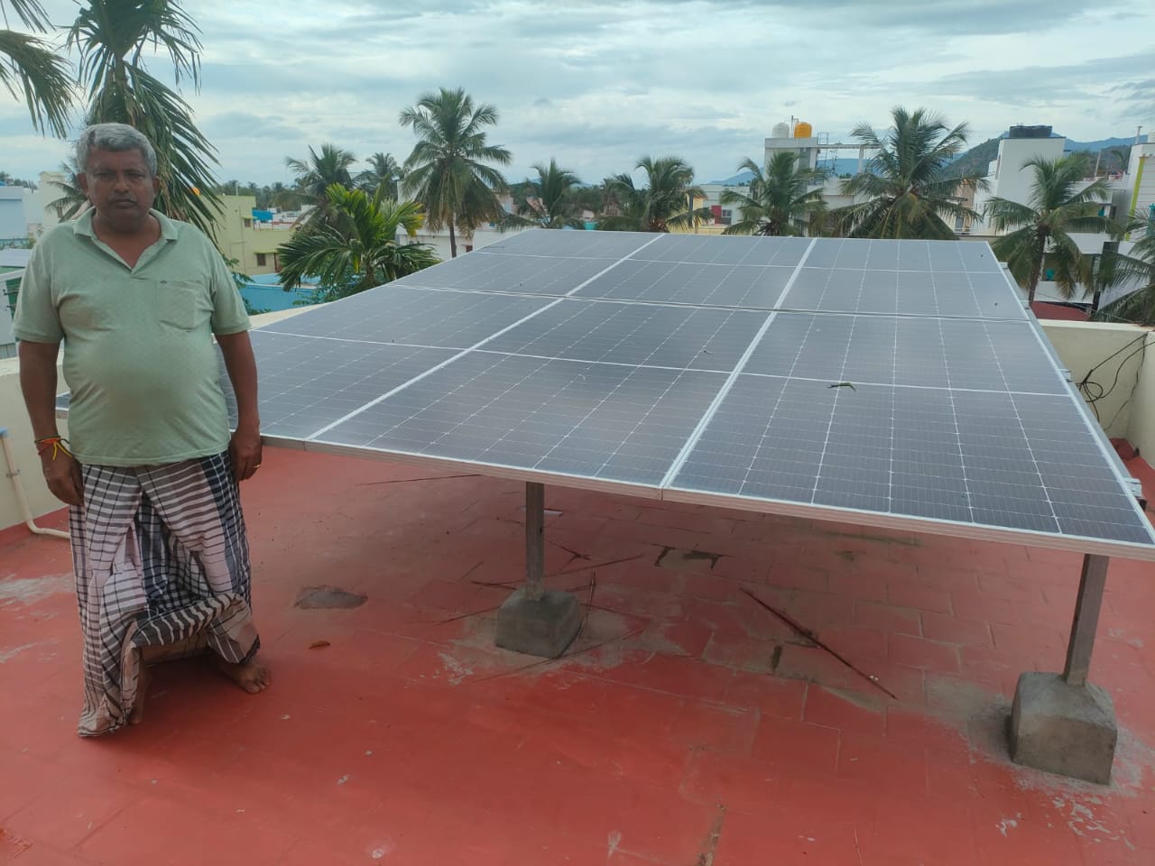 happy customer with his solar rooftop system happy customer with his solar rooftop system
